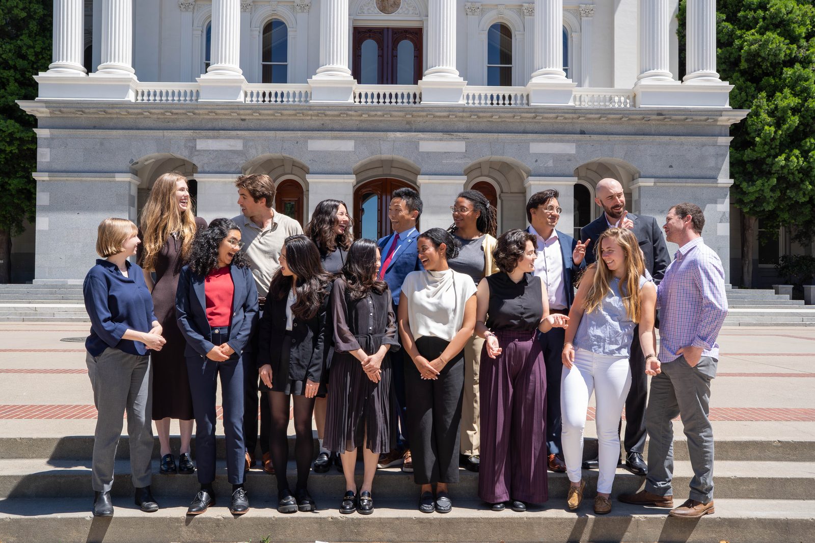 Group photo of fellows in Stanford's Rising Environmental Leaders Program on the steps of a capitol building.